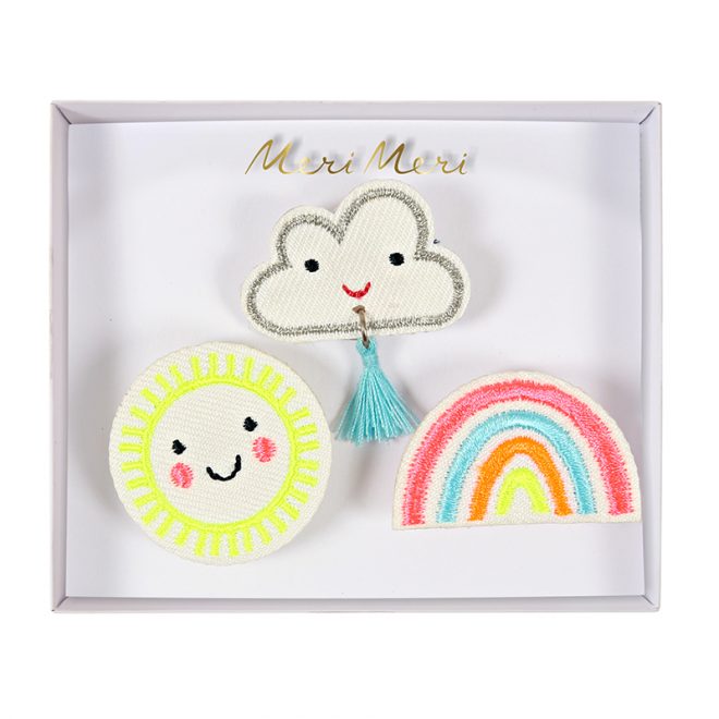 Weather faces brooches